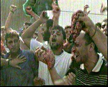 Blood thirsty Arabs in Gaza with ogans of soldiers killed when their APC was blown up